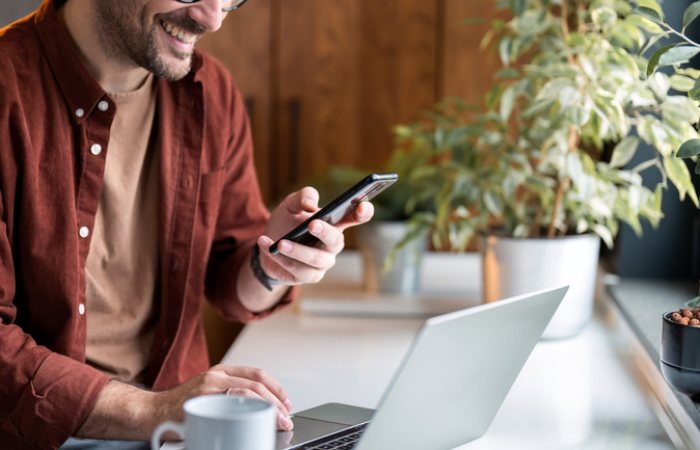 Person completing digital tasks on smartphone apps